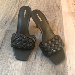 Black woven strap heels.